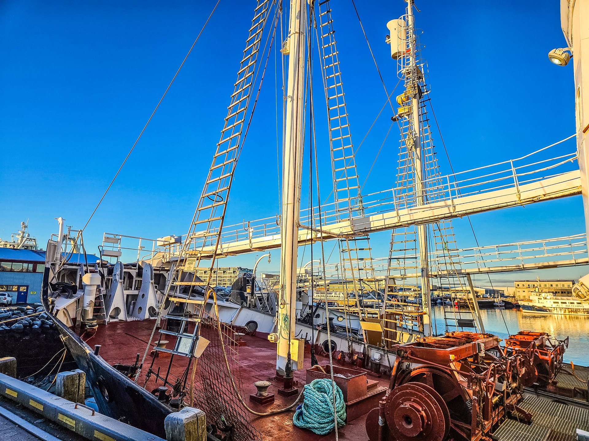Ship deck with winch and maritime equipment showing hands-on technical work