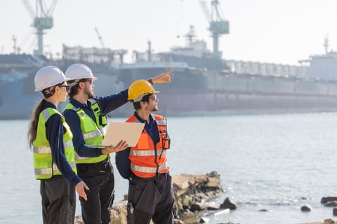 Black workers discussing plans at port