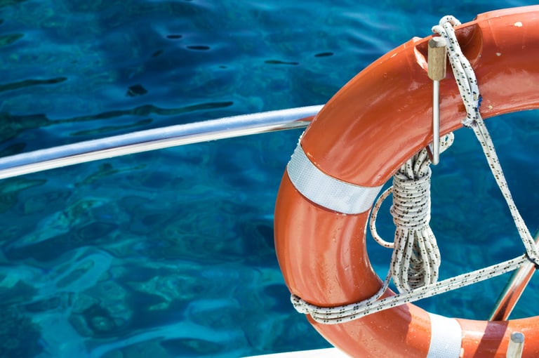 Life buoy attached to a vessel railing